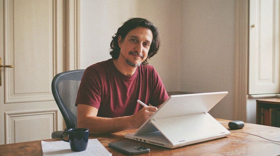 Dakota Warren, storyboard artist, drawing at his desk in Los Angeles